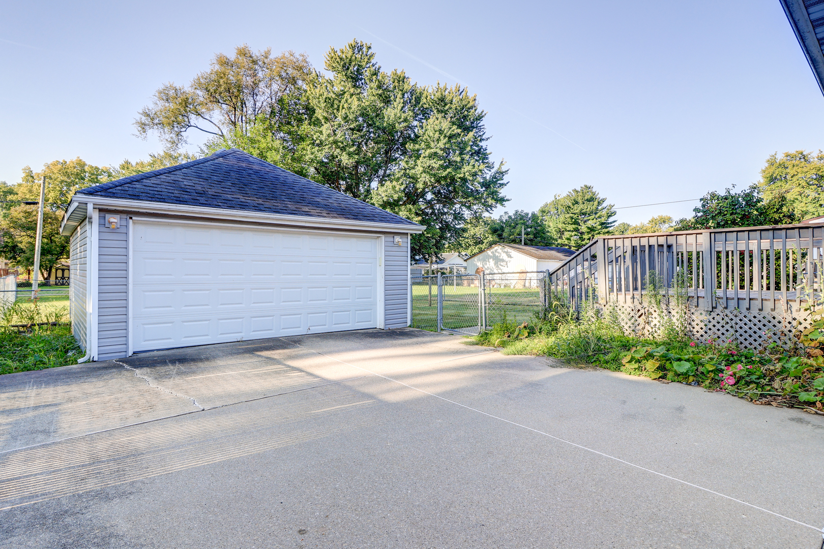 602 East 3rd Street Rock Falls, IL 61071 - Photo 4 of 22 a front view of a house with a yard and garage