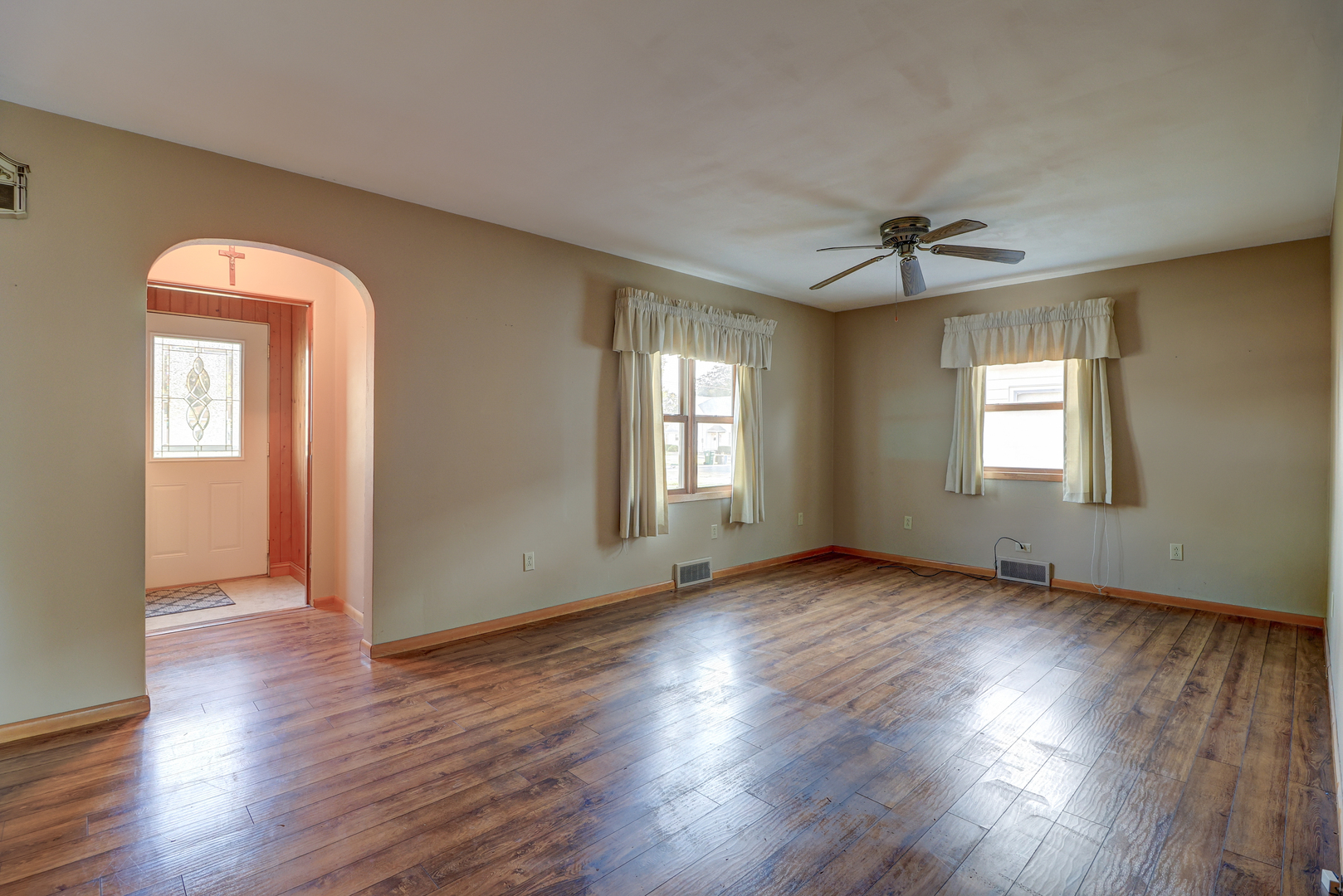602 East 3rd Street Rock Falls, IL 61071 - Photo 6 of 22 a view of an empty room with window and wooden floor