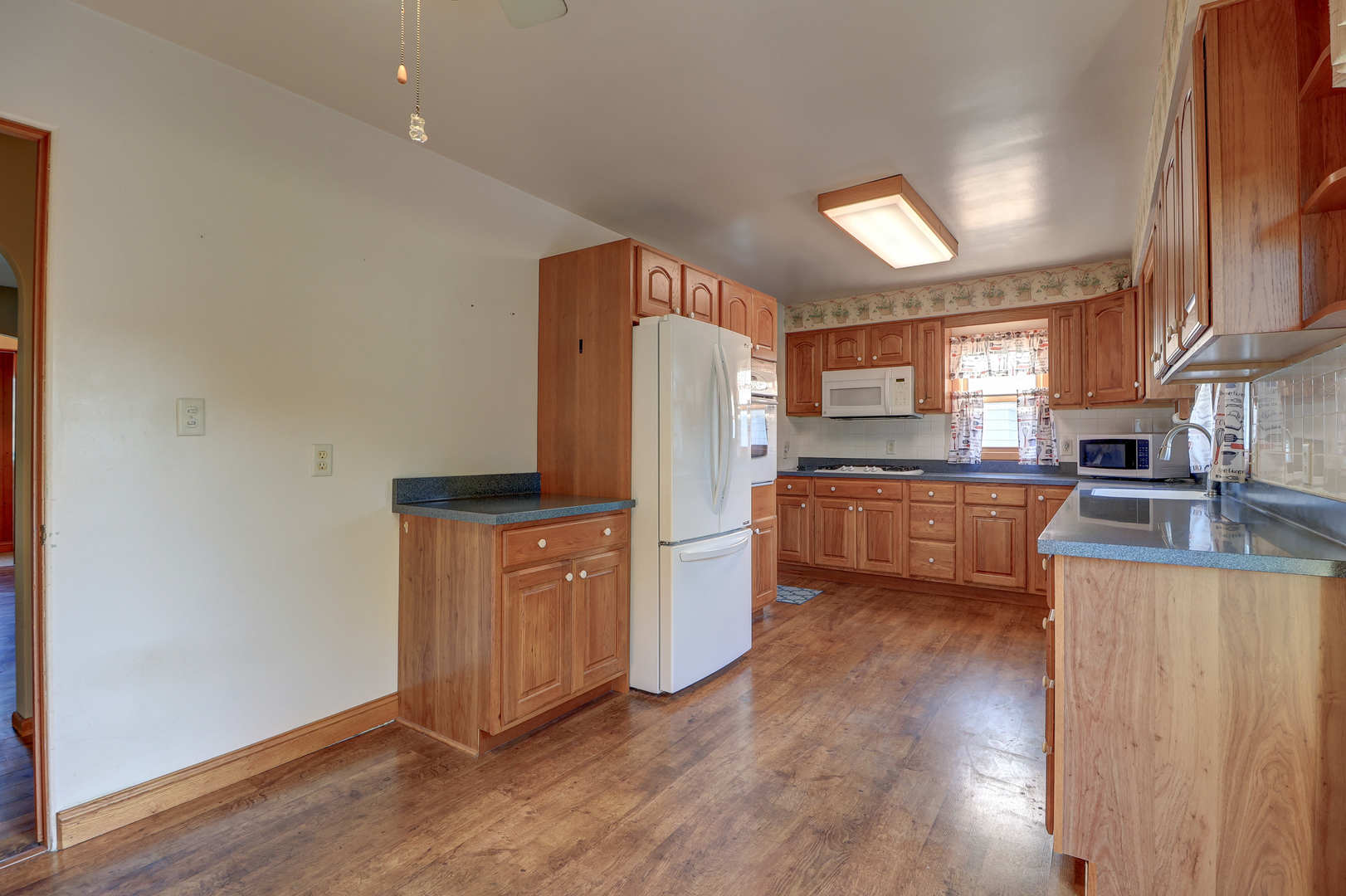 602 East 3rd Street Rock Falls, IL 61071 - Photo 9 of 22 a kitchen with stainless steel appliances a refrigerator and a stove top oven