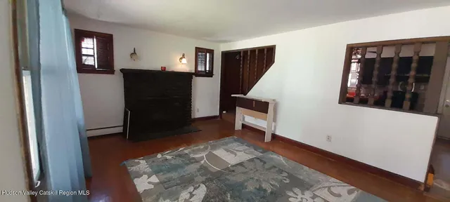 a view of entryway with furniture and a window