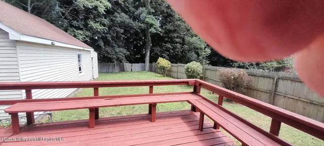 a view of a bench on the roof deck