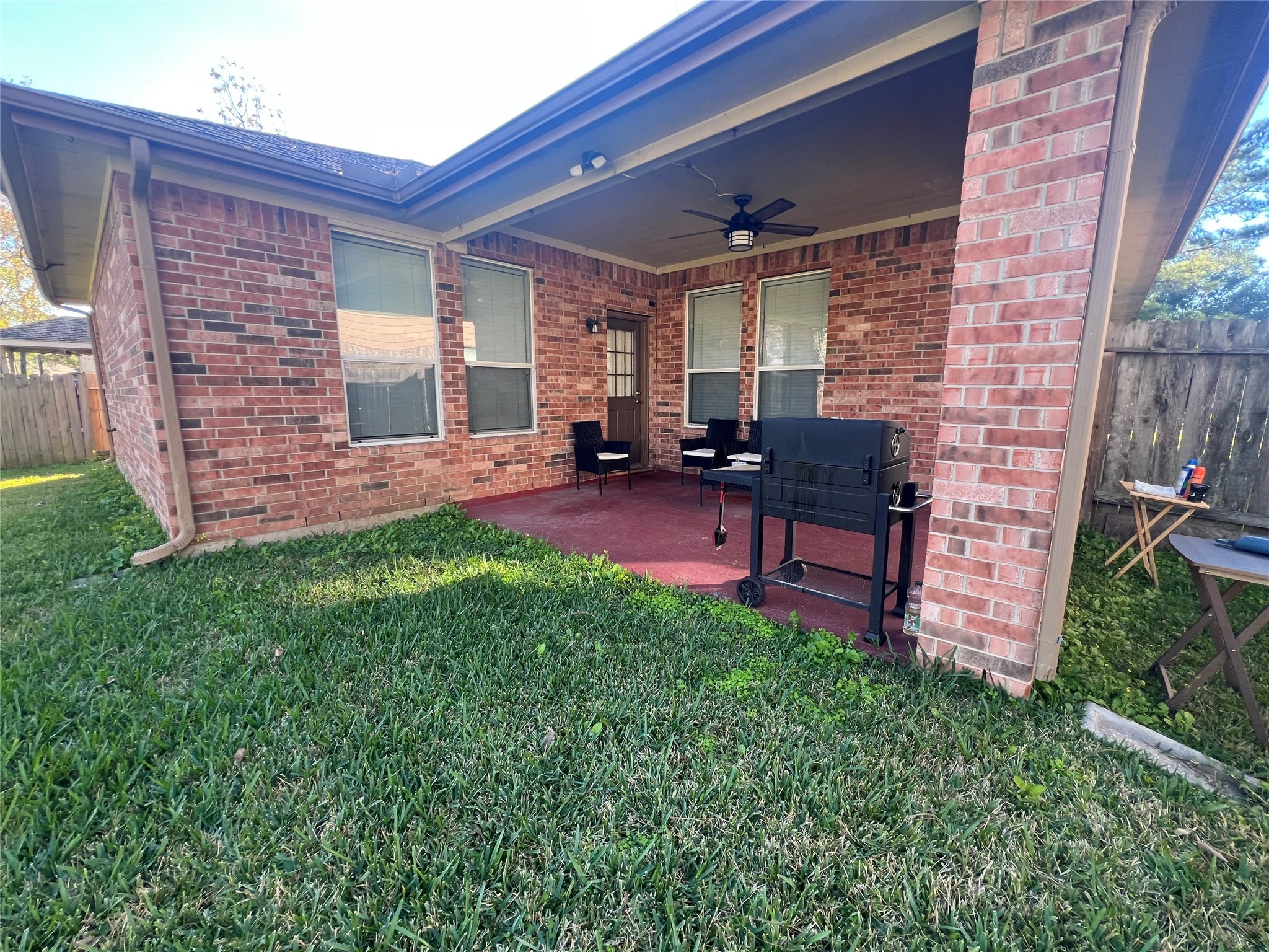 17618 Bryce Manor Lane Humble, TX 77346 - Photo 11 of 14 a view of a patio with table and chairs a barbeque in the yard