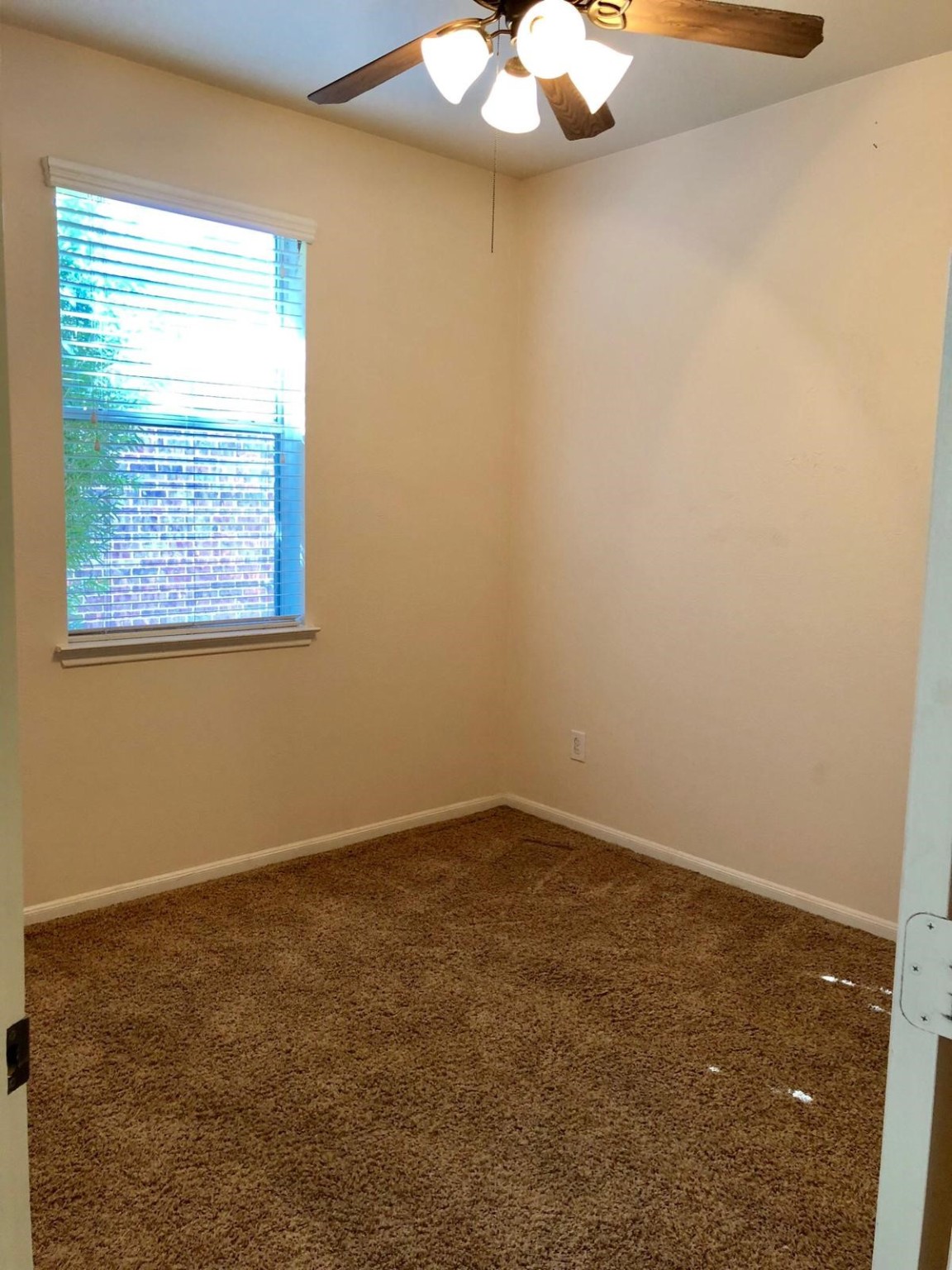 17618 Bryce Manor Lane Humble, TX 77346 - Photo 10 of 14 an empty room with a window