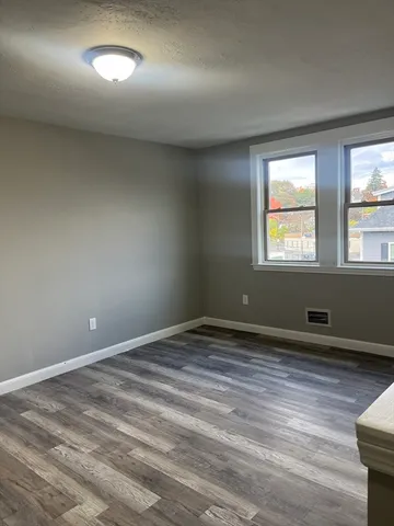 a view of an empty room and window