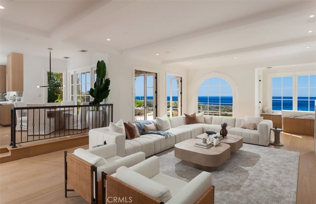a bathroom with a granite countertop sink toilet and mirror