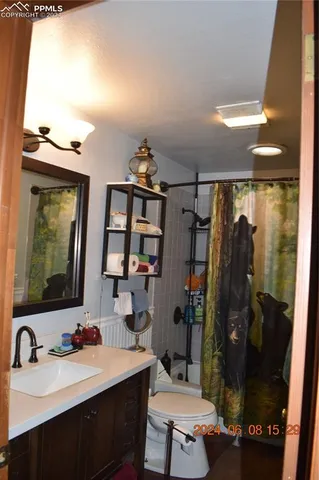 a living room with furniture and a large mirror