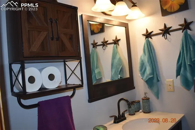 a living room with furniture a rug and a large window