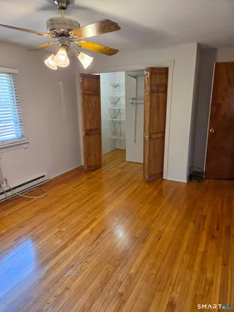 a view of a livingroom with wooden floor