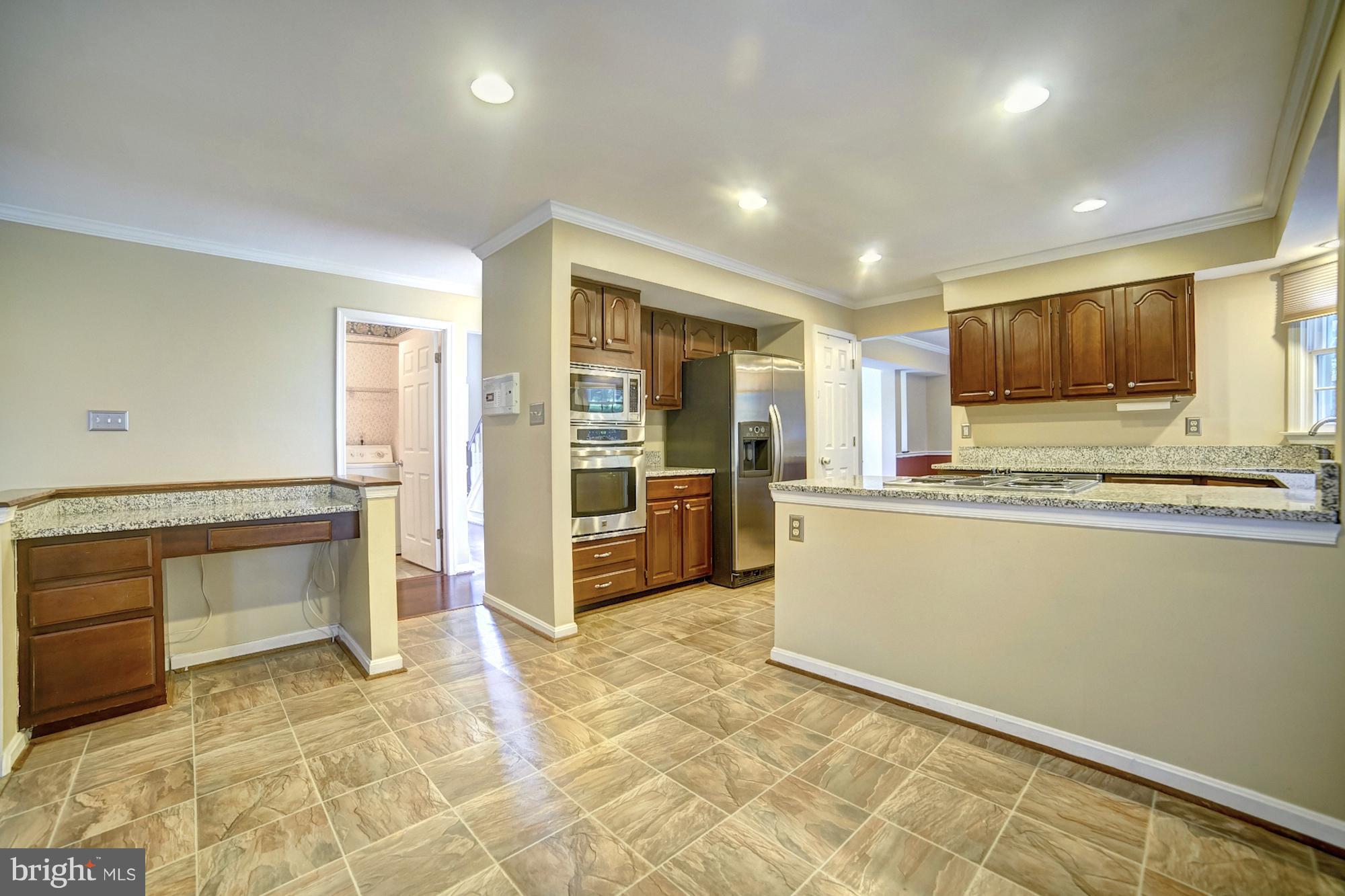 9520 Stoneoak Road Baltimore, MD 21236 - Photo 5 of 26 a view of kitchen with refrigerator and microwave