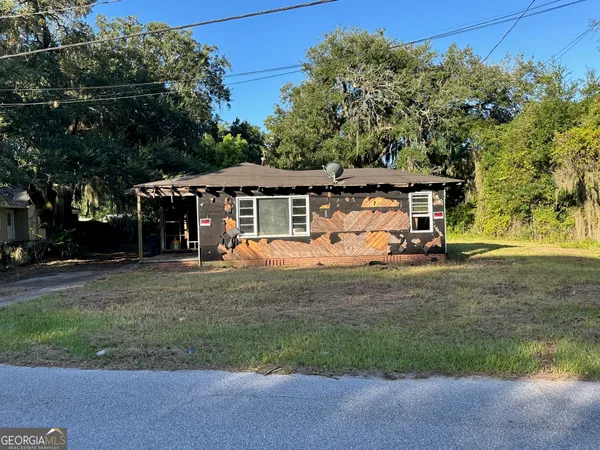 front view of a house with a yard