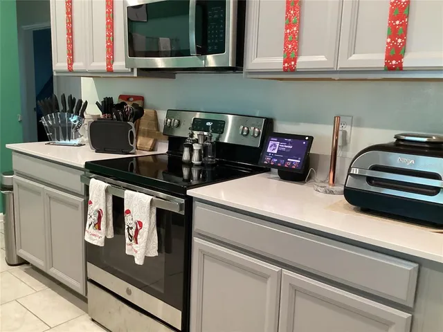a kitchen with a stove and cabinets