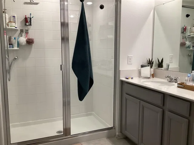 a bathroom with a double vanity sink