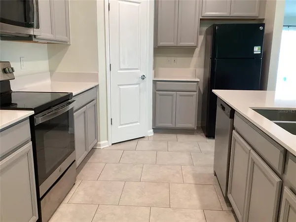 a bathroom with a sink vanity and a mirror