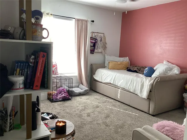 a bedroom with furniture and a bed