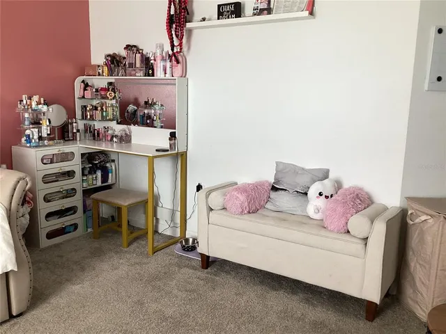 a bedroom with a bed and furniture