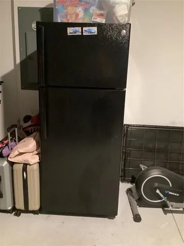 a close view of a sink and a refrigerator