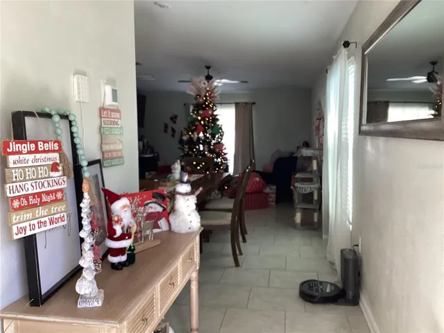 a bedroom with furniture and a potted plant