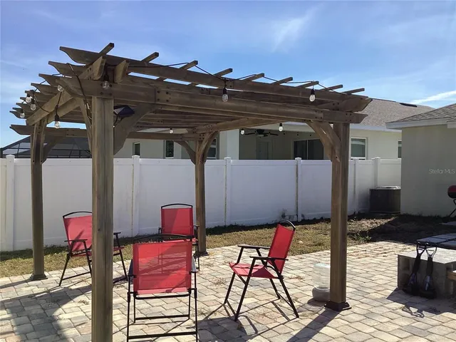 a view of a chairs and table in the patio