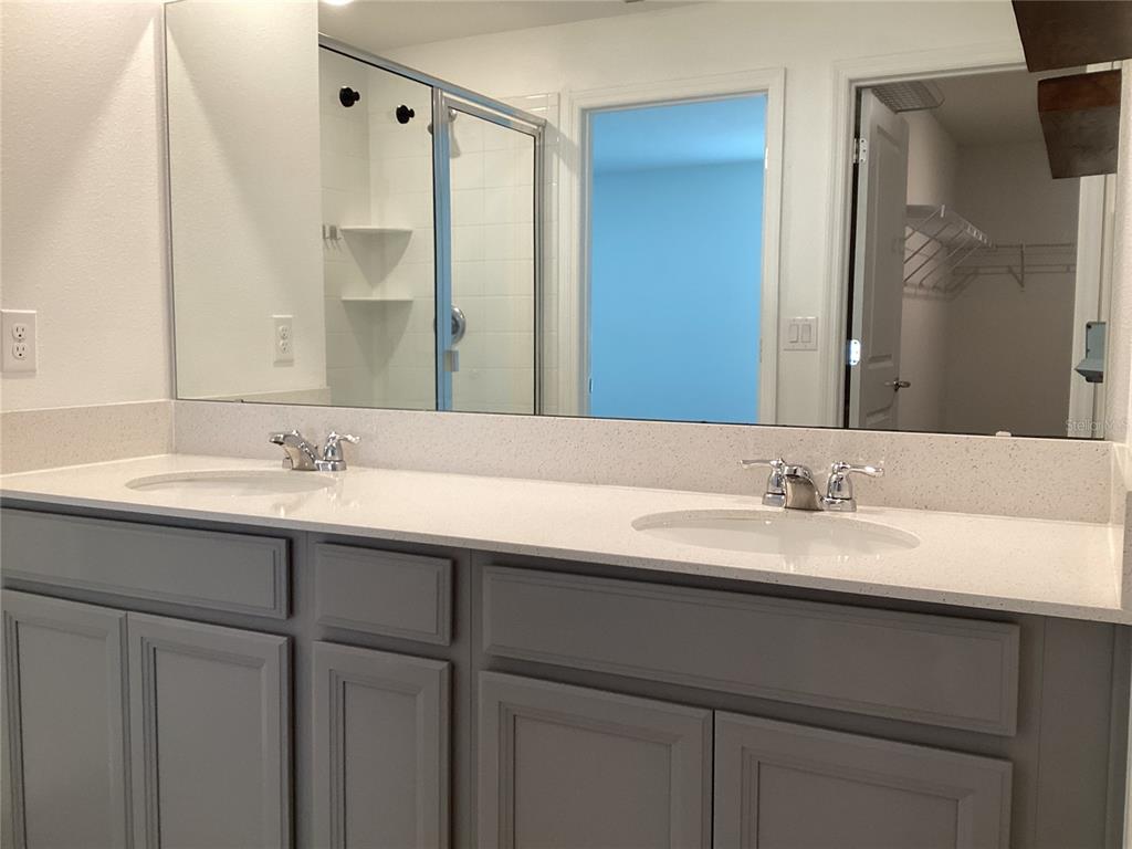 260 Pershing Street Bartow, FL 33830 - Photo 45 of 89 a bathroom with a double vanity sink and a mirror