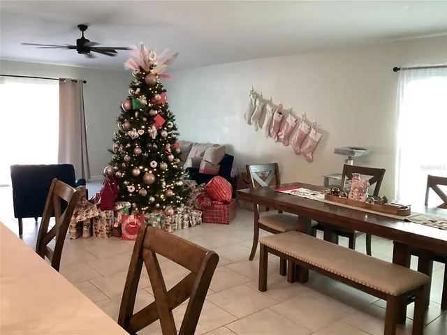 a living room with furniture and flowers