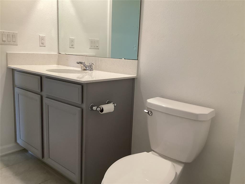 260 Pershing Street Bartow, FL 33830 - Photo 70 of 89 a white toilet sitting next to a bathroom sink