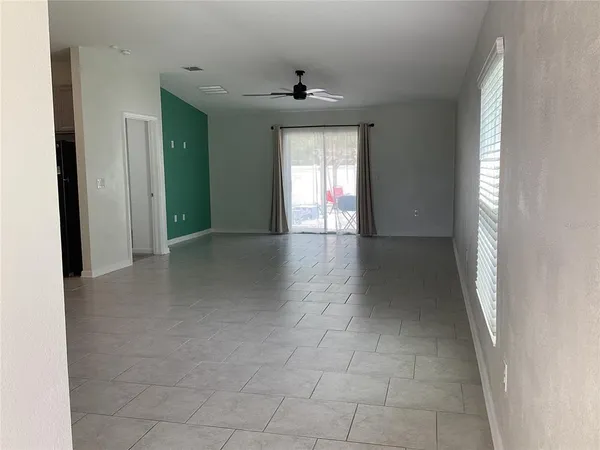 a kitchen with stainless steel appliances a sink a stove top oven a counter space and cabinets