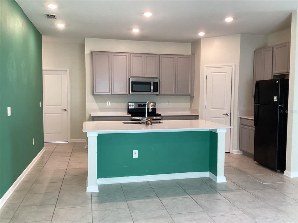 260 Pershing Street Bartow, FL 33830 - Photo 10 of 89 a view of kitchen with stainless steel appliances granite countertop a refrigerator and a sink