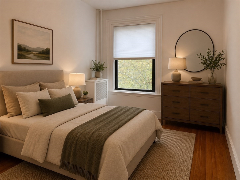 1064 Beacon Street, Unit 9 Brookline, MA 02446 - Photo 4 of 19 a bedroom with a bed and a dresser