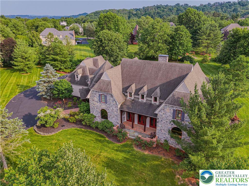 an aerial view of a house with a garden