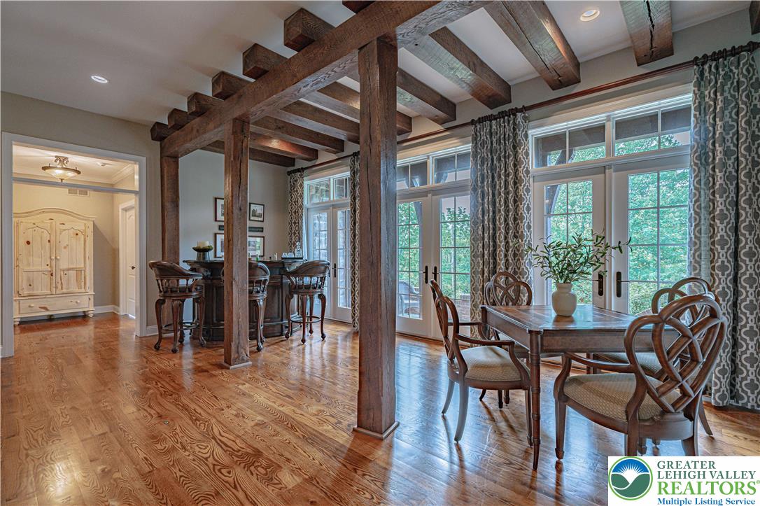 3054 Jordan Road Orefield, PA 18069 - Photo 11 of 58 a view of a dining room with furniture window and wooden floor