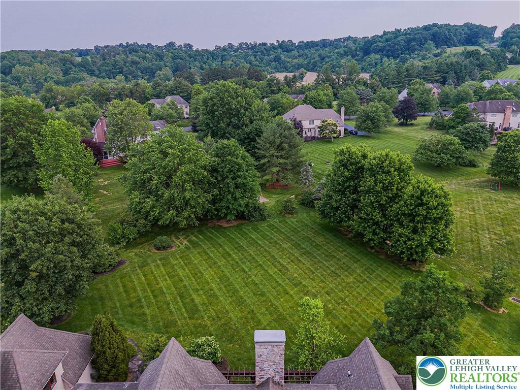 3054 Jordan Road Orefield, PA 18069 - Photo 3 of 58 a view of a garden with a building in the background