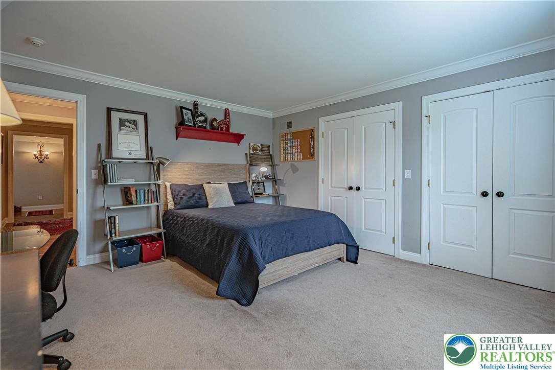 3054 Jordan Road Orefield, PA 18069 - Photo 32 of 58 a bedroom with a bed and a painting on the wall