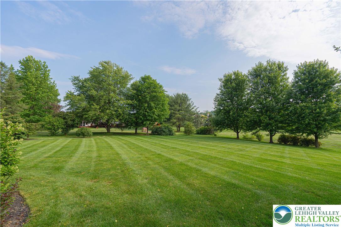 3054 Jordan Road Orefield, PA 18069 - Photo 46 of 58 a view of a golf course with a lake