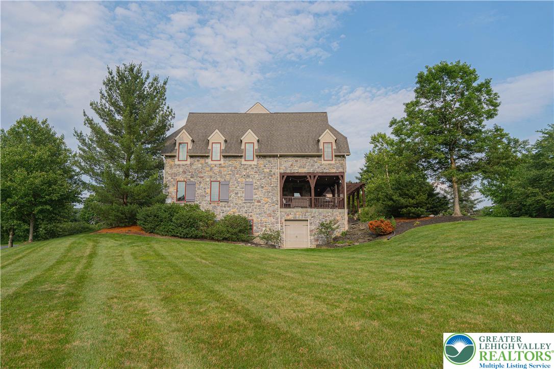 3054 Jordan Road Orefield, PA 18069 - Photo 5 of 58 a view of an house with backyard space and garden