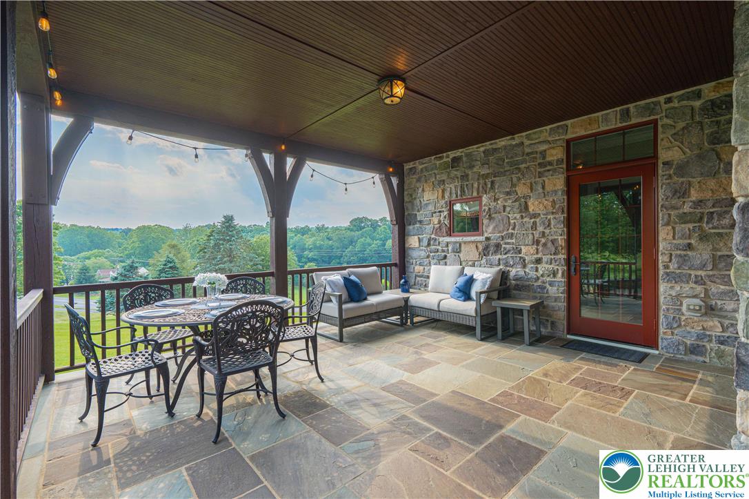 3054 Jordan Road Orefield, PA 18069 - Photo 52 of 58 a living room with patio furniture and a floor to ceiling window