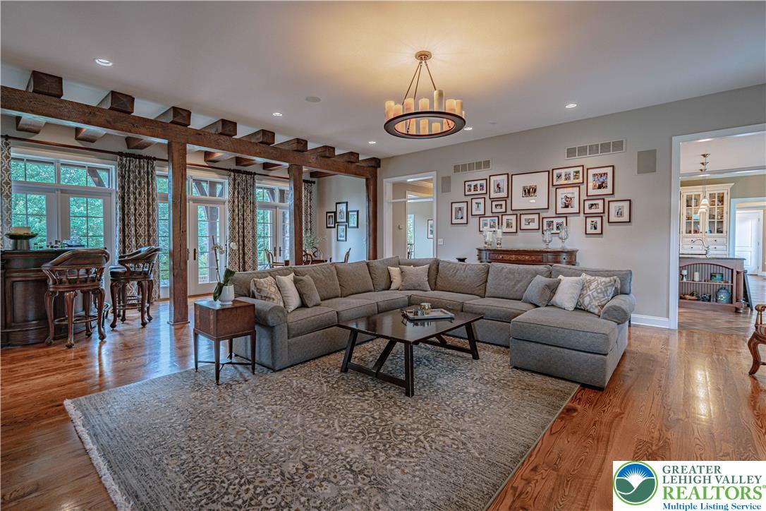 3054 Jordan Road Orefield, PA 18069 - Photo 9 of 58 a living room with furniture a chandelier and a dining table