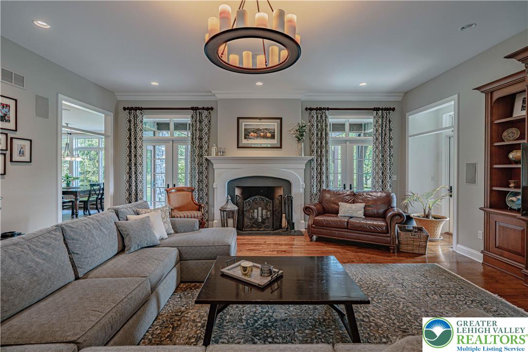 3054 Jordan Road Orefield, PA 18069 - Photo 10 of 58 a living room with furniture a fireplace and a large window