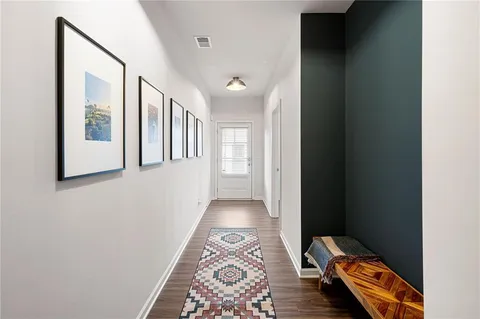 a view of an entryway with wooden floor
