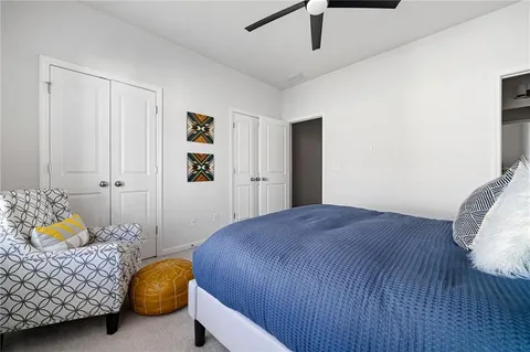 a bedroom with a bed and dresser