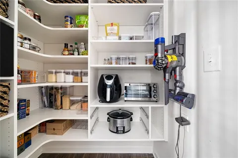 a kitchen with a fridge and sink