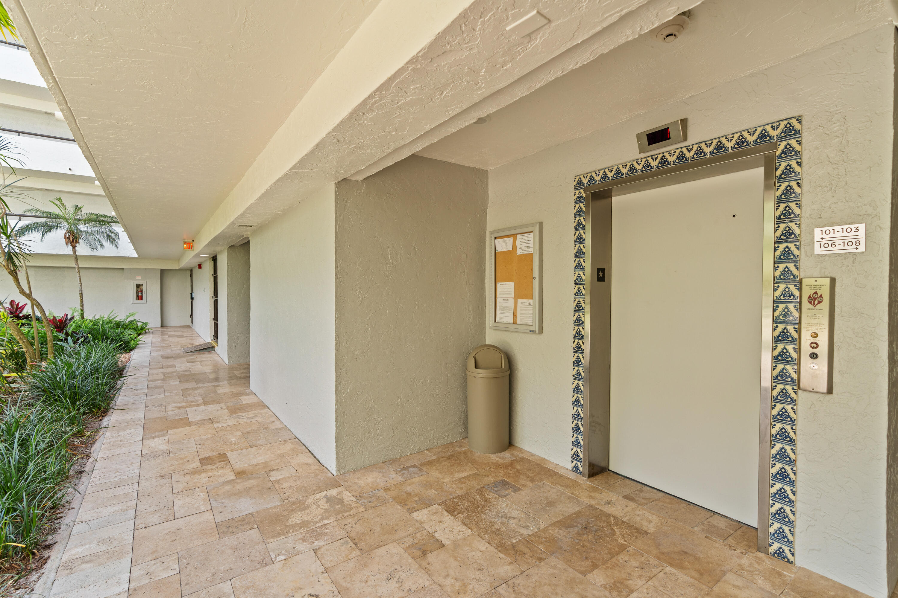 23200 Camino Del Mar, Unit 603 Boca Raton, FL 33433 - Photo 36 of 43 a view of a hallway to rooms