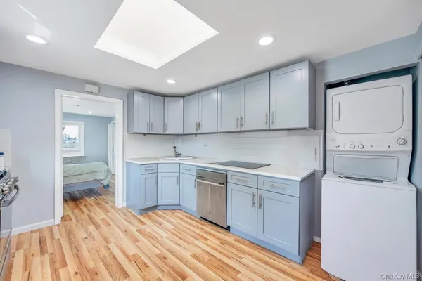 a kitchen with a sink stove and cabinets