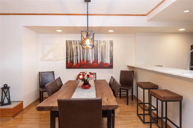 a kitchen that has a table and chairs in it