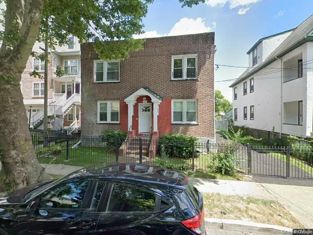 a view of multiple houses with a yard