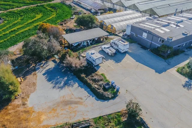 a view of a street with a car parked on the road