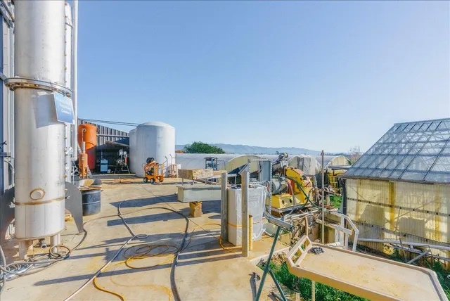 a view of a backyard with sitting area