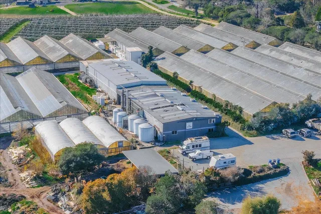 an aerial view of a house with a garden