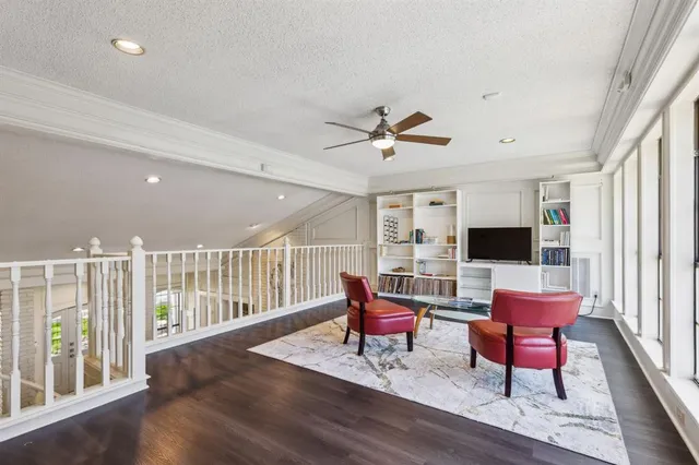 a kitchen with granite countertop a sink window and cabinets