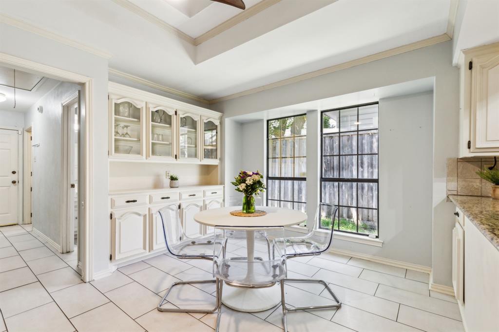 4130 High Star Lane Dallas, TX 75287 - Photo 15 of 38 a view of a dining room with furniture and wooden floor