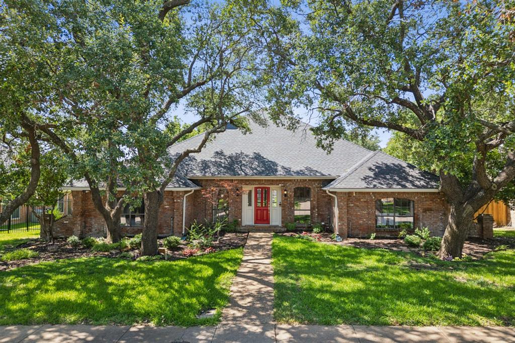 4130 High Star Lane Dallas, TX 75287 - Photo 2 of 38 front view of a house with a garden